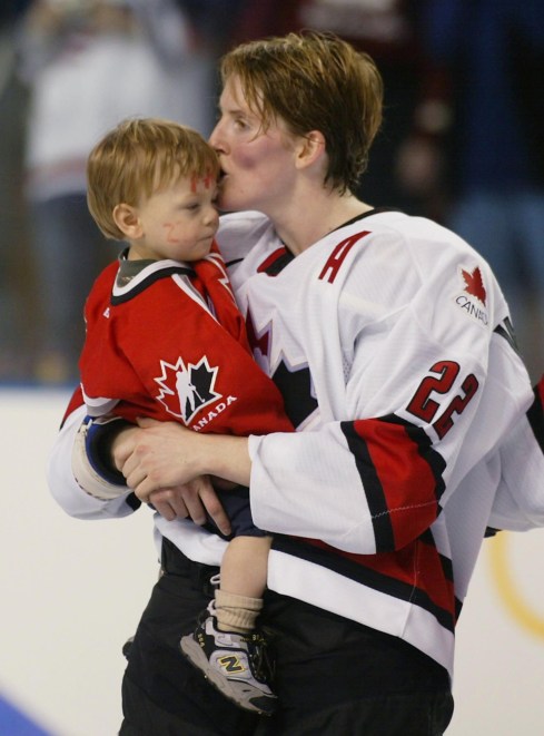 Olympic gold medalist Hayley Wickerheiser, of Shaunavon, Sask., kisses her son Noah Pachina following Canada's 3-2 victory against USA in women's hockey tournament at the Olympic Winter Games in Salt Lake City, Utah, Thursday Feb. 21, 2002. (CP PHOTO/Tom Hanson)