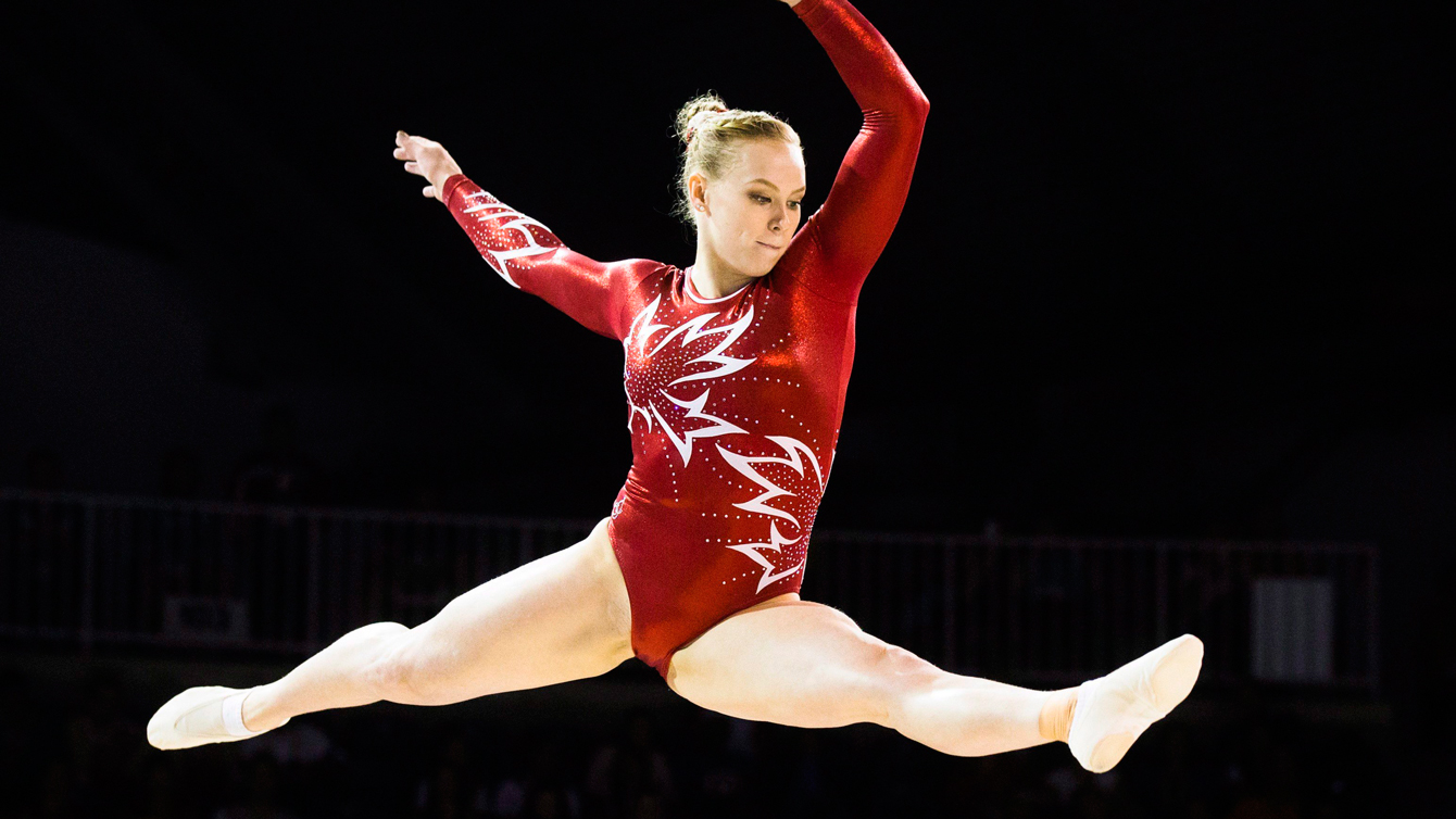 Ellie Black takes a long throw on the beam.